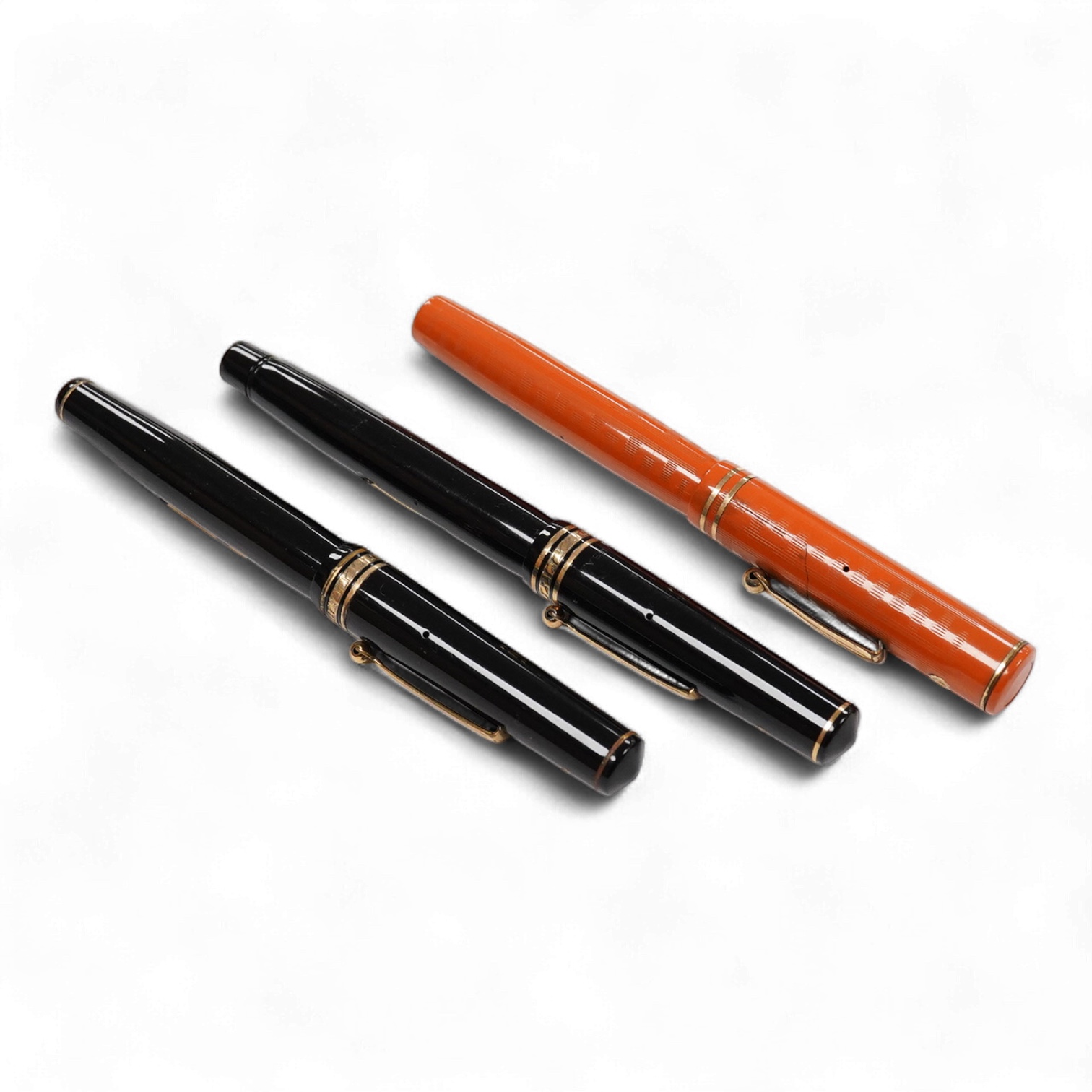 A Wahl Eversharp red hard rubber pen (crack to cap) and two other Wahl pens for spares